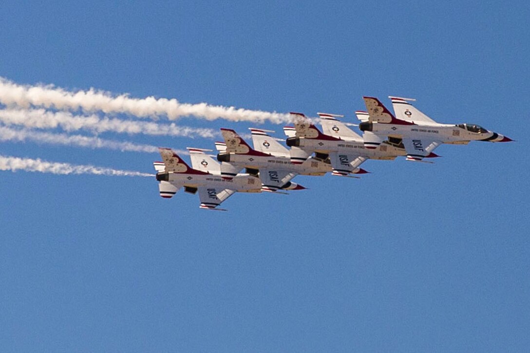 The U.S. Air Force Aerial Demonstration Squadron, the Thunderbirds, arrive for the 2015 Joint Base San Antonio Open House on Joint Base San Antonio-Randolph, Texas, Oct. 26, 2015. U.S. Air Force photo by Joshua Rodriguez