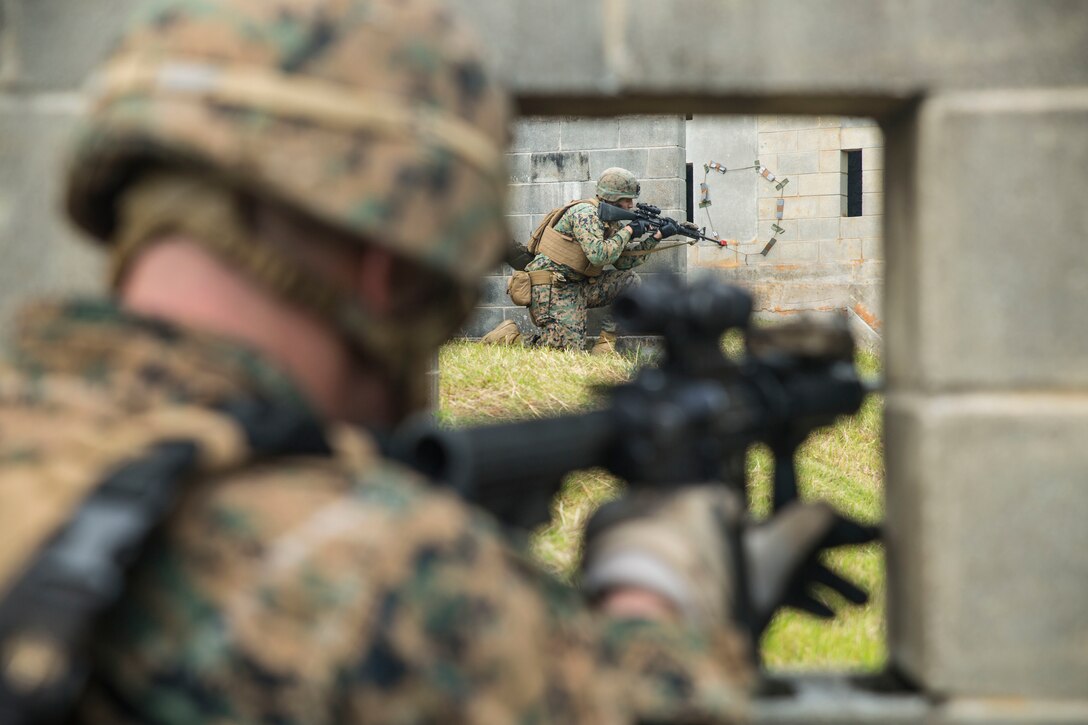 Marines take over Combat Town, at the Central Training Area, Okinawa, Japan, Oct. 26, 2015. Marines rode into Combat Town on Amphibious Assault Vehicles during the training event, which was part of Blue Chromite 2016. Blue Chromite is a large-scale, cost-effective on-island exercise led by 4th Marine Regiment. Each element of III Marine Expeditionary Force is represented in Blue Chromite. The training gives Navy and Marine units the opportunity to complete high-level, cost effective training in a realistic, expeditionary environment. Blue Chromite is designed to improve cohesion among all elements of the Marine Air Ground Task Force. The Marines are from Combat Assault Battalion, 3rd Marine Division, III Marine Expeditionary Force. 