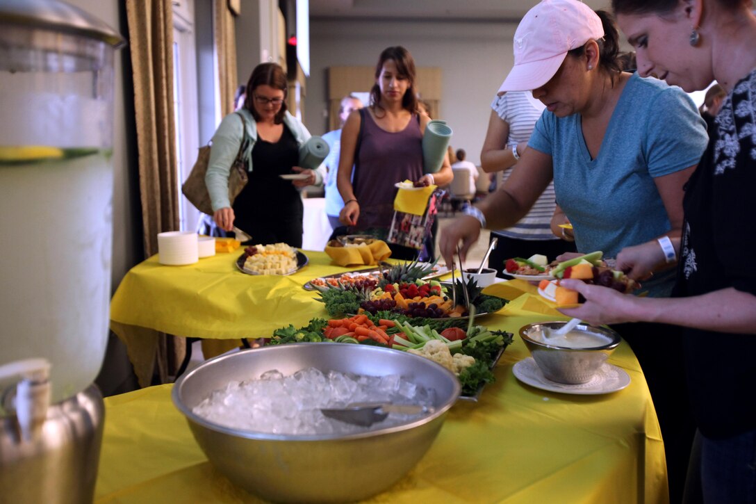 Spouses of active-duty service members sample snacks during the annual Spouses Spa Day hosted by Marine Corps Family Team Building at Marine Corps Air Station Cherry Point, N.C., Oct. 22, 2015. During the event spouses of active-duty service members were pampered with facials, foot soaks and were given strategies to help them relax. Spouses enjoyed free yoga, fresh smoothies and mini spa treatments. MCFTB used the event as an opportunity to give the ladies a relaxing experience to combat the stresses of being a military spouse. (U.S. Marine Corps photo by Lance Cpl. Jason Jimenez/Released)