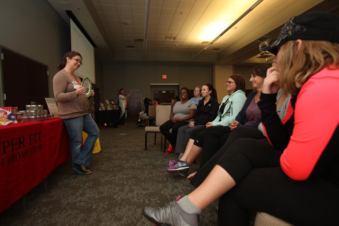 Spouses of active-duty service members receive a nutrition class during the annual Spouses Spa Day hosted by Marine Corps Family Team Building at Marine Corps Air Station Cherry Point, N.C., Oct. 22, 2015. During the event spouses of active-duty service members were pampered with facials, foot soaks and were given strategies to help them relax. Spouses enjoyed free yoga, fresh smoothies and mini spa treatments. MCFTB used the event as an opportunity to give the ladies a relaxing experience to combat the stresses of being a military spouse. (U.S. Marine Corps photo by Lance Cpl. Jason Jimenez/Released)