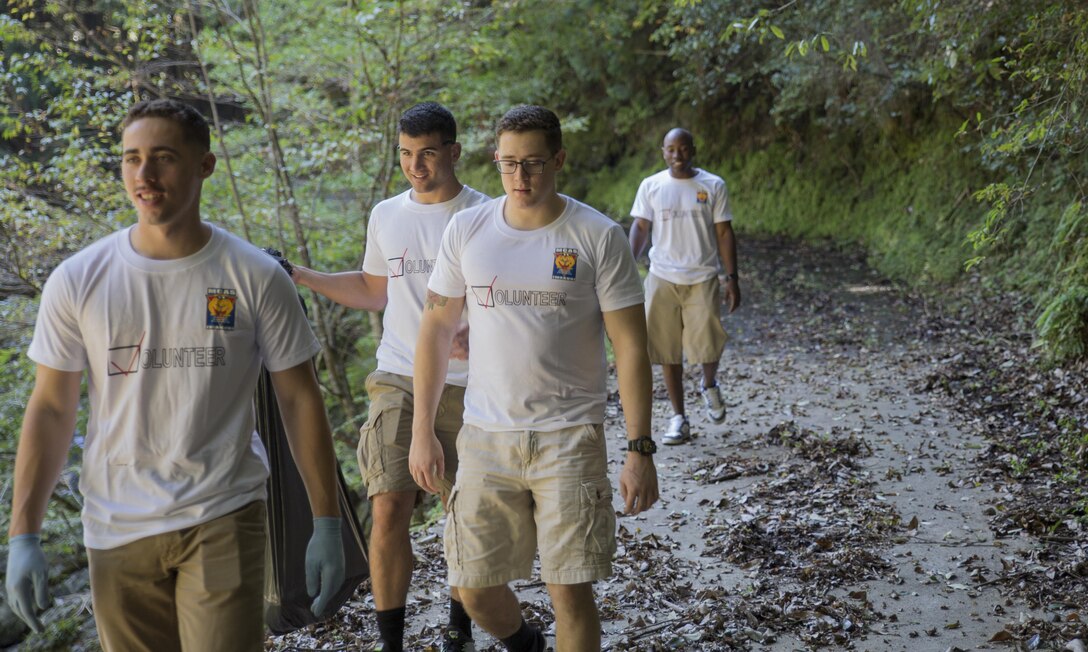 Station Volunteers look for trash at Futashika Umezu Falls, in Futashika, Yamaguchi Prefecture, Japan, Oct. 16, 2015. The Single Marine Program at Marine Corps Air Station Iwakuni, Japan, provides residents volunteer opportunities to build relations with Japanese locals and experience part of the foreign culture.  Volunteers enjoyed the scenery of the forest, river and waterfalls, as they picked up trash and debris along the river.