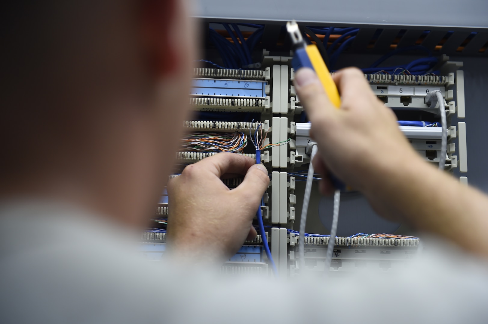 U.S. Air Force Staff Sgt. Andrew Solito, cyber transport technician, uses a punch down and tone generator to locate power for ethernet cables during Vigilant Shield 16 at 5 Wing Goose Bay, Canada, Oct. 11, 2015. From Oct. 15 to 26, 2015, approximately 700 members from the Canadian Armed Forces, the United States Air Force, the United States Navy, and the United States Air National Guard are deploying to Iqualuit, Nunavut, and 5 Wing Goose Bay, Newfoundland and Labrador for Exercise Vigilant Shield 16. (U.S. Air Force photo by Senior Airman Jasmonet Jackson/Released)
