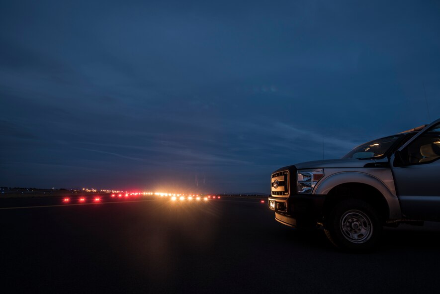 Lights illuminate the runway Oct. 21, 2015, at Fairchild Air Force Base, Wash. When a defective light is found it is annotated in the airfield inspection checklist to be replaced. (U.S. Air Force photo/Airman 1st Class Sean Campbell)