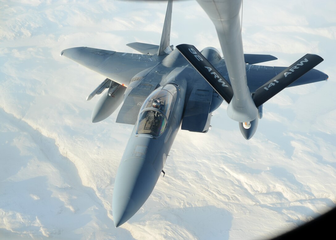 First Lt. Johnathan Pavan, 194th Fighter Squadron pilot, flies an F-15C Eagle assigned to the 144th Fighter Wing, Fresno Air National Guard Base, California, during an aerial refuling mission with a KC-135 Stratotanker assigned to Farichild Air Force Base, Wash., Oct. 20, 2015, over northern Canada. From Oct. 15 - 26, 2015, approximately 700 members from the Canadian Armed Forces, United States Air Force, United States Navy, and United States Air National Guard are deploying to Iqaluit, Nunavut, and 5 Wing Goose Bay, Newfoundland and Labrador for Exercise Vigilant Shield 16 (U.S. Air Force photo by Senior Airman Victor J. Caputo)