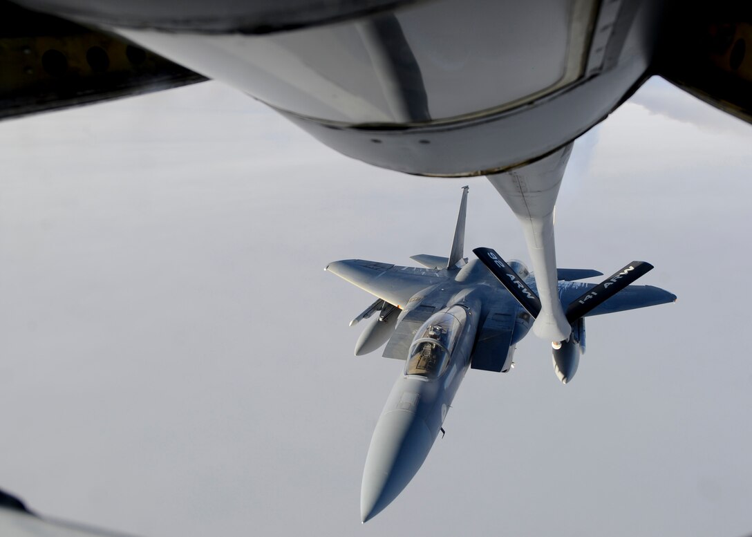 An F-15C Eagle assigned to the 144th Fighter Wing, Fresno Air National Guard Base, California, approaches a KC-135 Stratotanker assigned to Fairchild Air Force Base, Wash., for an aerial refueling, Oct. 20, 2015, over northern Canada. From Oct. 15 - 26, 2015, approximately 700 members from the Canadian Armed Forces, United States Air Force, United States Navy, and United States Air National Guard are deploying to Iqaluit, Nunavut, and 5 Wing Goose Bay, Newfoundland and Labrador for Exercise Vigilant Shield 16 (U.S. Air Force photo by Senior Airman Victor J. Caputo)