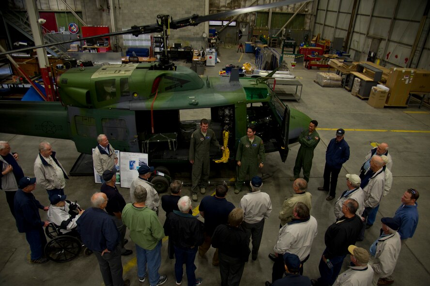 Aircrew members of the 36th Rescue Squadron brief the Tempe Diplomats as part of a base tour Oct. 23, 2015, at Fairchild Air Force Base, Wash. The 36th RQS’s main mission is to support the Survival, Evasion, Resistance, and Escape school and performing civilian search and rescue operations when called upon. (U.S. Air Force photo/Airman 1st Class Nick J. Daniello)