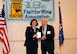 Col. Lisa Craig, 433rd Mission Support Group commander, presents Col. (ret) Julian Crowe with the Republic of Korea Ambassador for Peace Medal Oct. 24, 2015 during the 18th Fighter Bomber Wing Association dinner at the Double Tree Hotel in San Antonio, Texas. Crow was the commander of the 67th Fighter Bomber Squadron and flew 101 missions in Korea and served 25 years in the United States Air Force. (Photo by Susan Kee) (released)