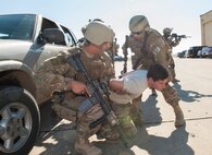 Members of the 791st Missile Security Forces Squadron tactical response force apprehend a suspect during a training exercise at Minot Air Force Base, N.D., Oct. 8, 2015. TRF is a nuclear special weapons and tactics team specializing in recapture and recovery operations. (U.S. Air Force photo/Airman 1st Class Christian Sullivan)