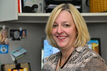 Carol Phillips, school liaison officer at Malmstrom Air Force Base Airman and Family Readiness Center, a key spouse and wife of Col. Christopher Phillips, 341st Medical Group commander, poses for a photo at work Oct. 21, 2015, at Malmstrom Air Force Base, Mont. Phillips said the key to a successful life in the military is a strong marriage and mutual respect. (U.S. Air Force photo/Airman Daniel Brosam)