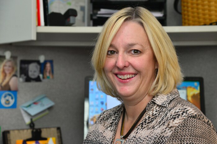 Carol Phillips, school liaison officer at Malmstrom Air Force Base Airman and Family Readiness Center, a key spouse and wife of Col. Christopher Phillips, 341st Medical Group commander, poses for a photo at work Oct. 21, 2015, at Malmstrom Air Force Base, Mont. Phillips said the key to a successful life in the military is a strong marriage and mutual respect. (U.S. Air Force photo/Airman Daniel Brosam)