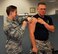 WRIGHT-PATTERSON AIR FORCE BASE, Ohio – Staff Sgt. Sydney Winnenberg, aerospace medical technician with the 445th Aerospace Medicine Squadron, administers the flu shot to Senior Airman Michael Briggs, community services journeyman with the 445th Force Support Squadron Sustainment Services Flight, during the Oct. 4, 2015 unit training assembly. The wing provided immunizations to 445th Airlift Wing reservists that day in preparation for the upcoming flu season, which most commonly peaks in the United States in the months of January or February. (U.S. Air Force photo/Senior Airman Joel McCullough)