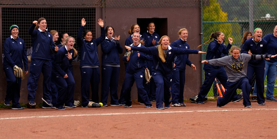 Members of the University of Notre Dame softball team celebrate during a scrimmage against the Ramstein Air Base Lady Rams Oct. 21, 2015, at Ramstein Air Base, Germany. The scrimmage was part of the Notre Dame softball team’s base visit during their 10-day European tour. Notre Dame team members also held softball instructional clinics for students at Ramstein and Kaiserslautern High Schools. (U.S. Air Force photo/Staff Sgt. Sharida Jackson