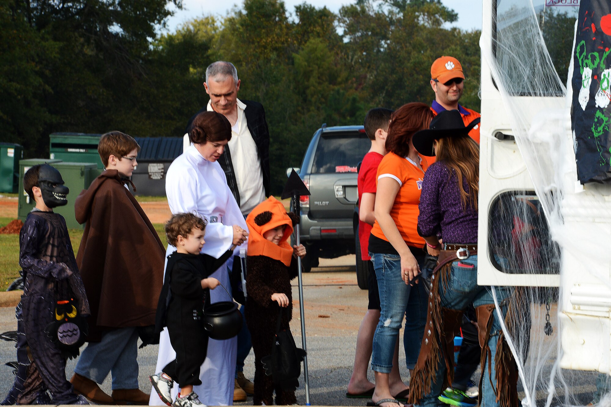 U.S. Air Force Lt. Col. William Miller, U.S. Air Forces Central intelligence directorate resources division chief, leads his family, dressed as ‘Star Wars’ characters, into the 20th Civil Engineer Squadron haunted house during Boo Bash at Shaw Air Force Base, S.C., Oct. 24, 2015. Six private organizations from around the base decorated 16 vehicle trunks and distribute candy to Team Shaw families. (U.S. Air Force photo by Senior Airman Jonathan Bass/Released)