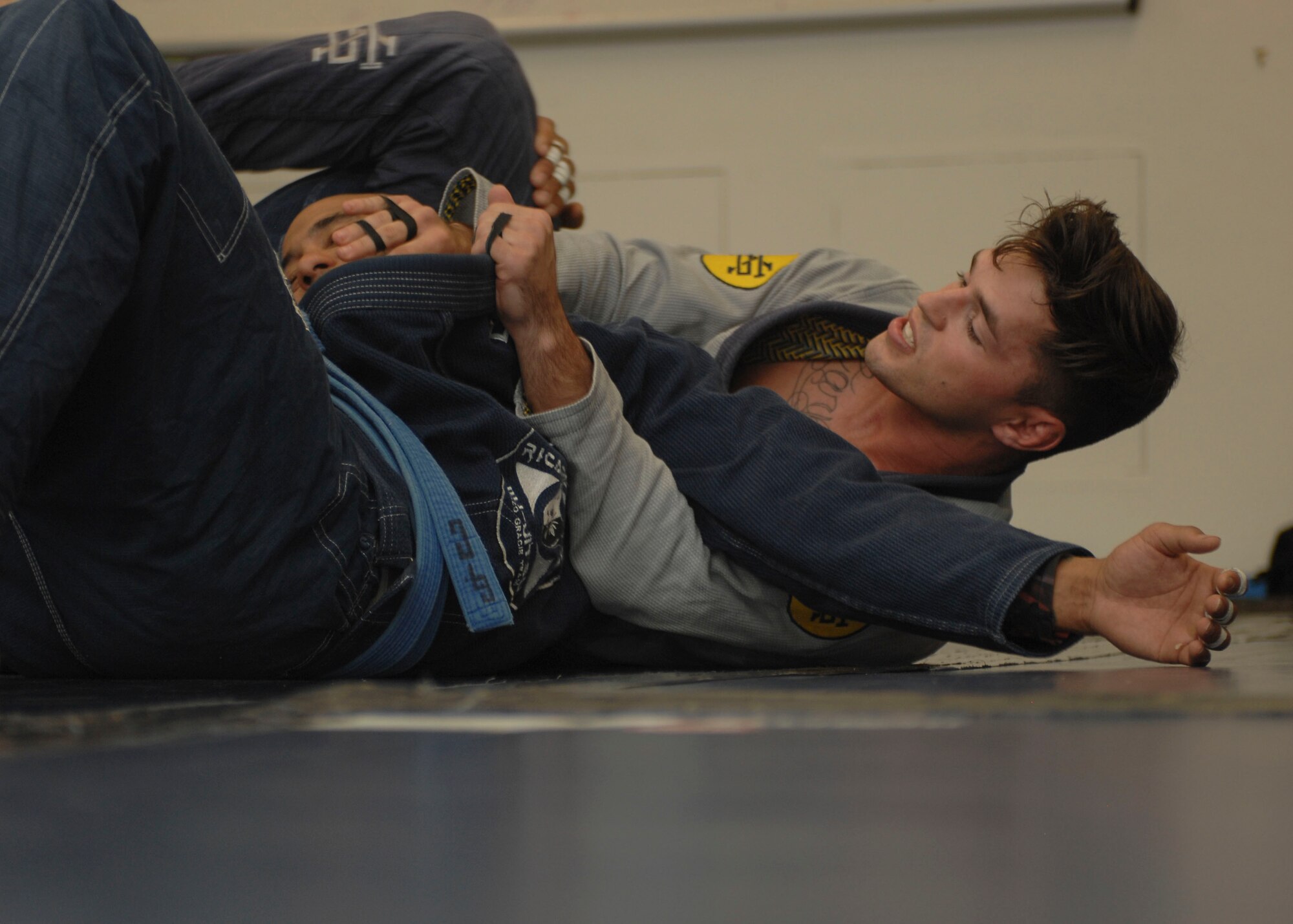 U.S. Air Force Senior Airman Jeremiah Garber, 355th Maintenance Group analyst, spars with Garrett Clark, Air Force veteran and jiujitsu instructor, during Brazilian Jujitsu class at Davis-Monthan Air Force Base, Ariz., Sept. 30, 2015. Jiujitsu consists of two submissions; joint manipulation and chokes; there’s no striking and throwing is frowned upon. (U.S. Air Force photo by Airman Basic Nathan H. Barbour/Released)