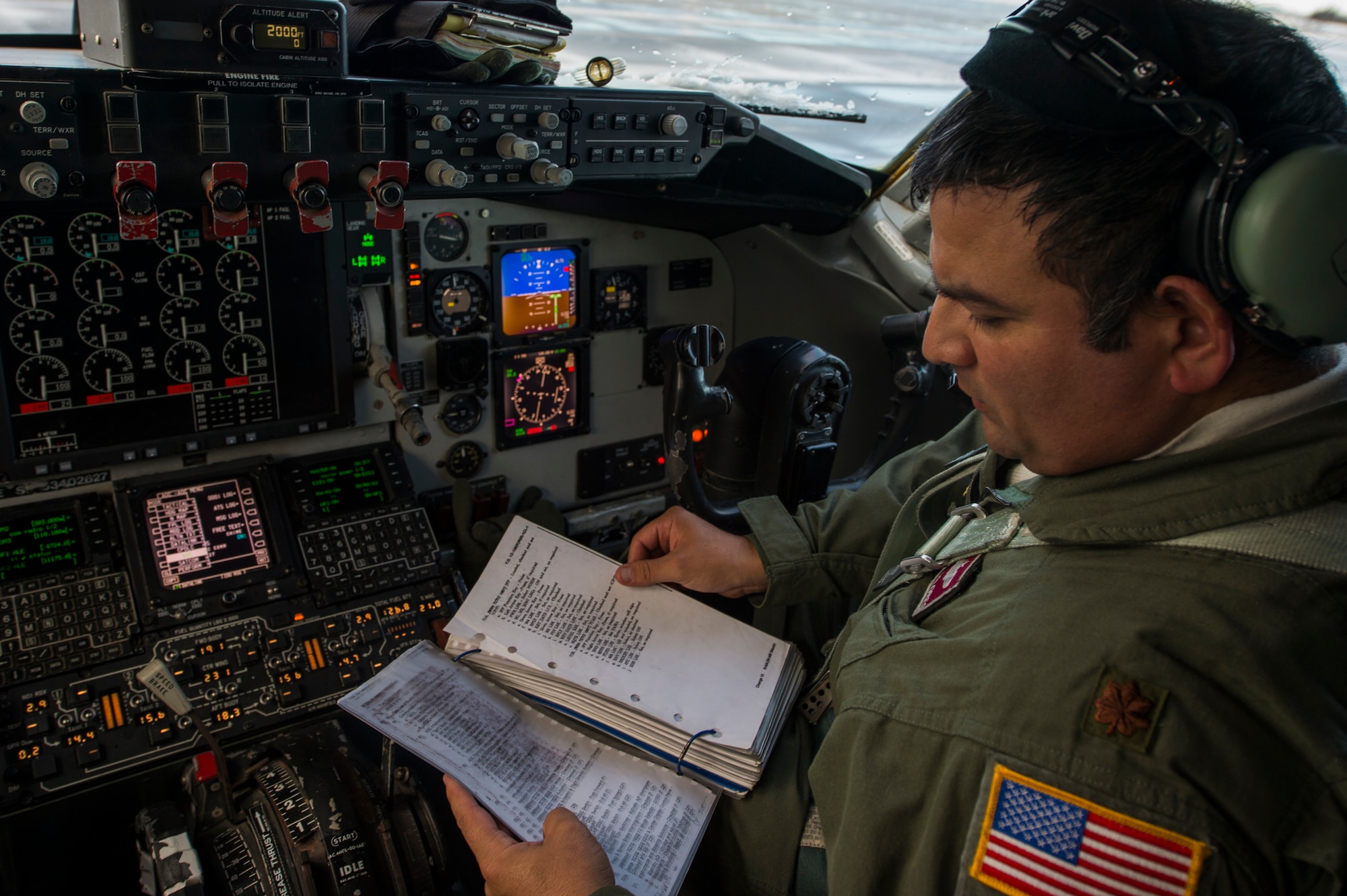 U.S. Maj. Jonathan Flores, 384th Air Refueling Squadron pilot, reads over pre-flight checklist for a KC-135 Stratotanker prior to a sortie in support of Vigilant Shield 16 at 5 Wing Goose Bay, Canada, Oct. 19, 2015. From Oct. 15-26, 2015, approximately 700 members from the Canadian Armed Forces, the United States Air Force, the United States Navy, and the United States Air National Guard are deploying to Iqaluit, Nunavut, and 5 Wing Goose Bay, Newfoundland and Labrador, for Exercise Vigilant Shield 16. (U.S. Air Force photo by Tech. Sgt. Joshua J. Garcia/Released)