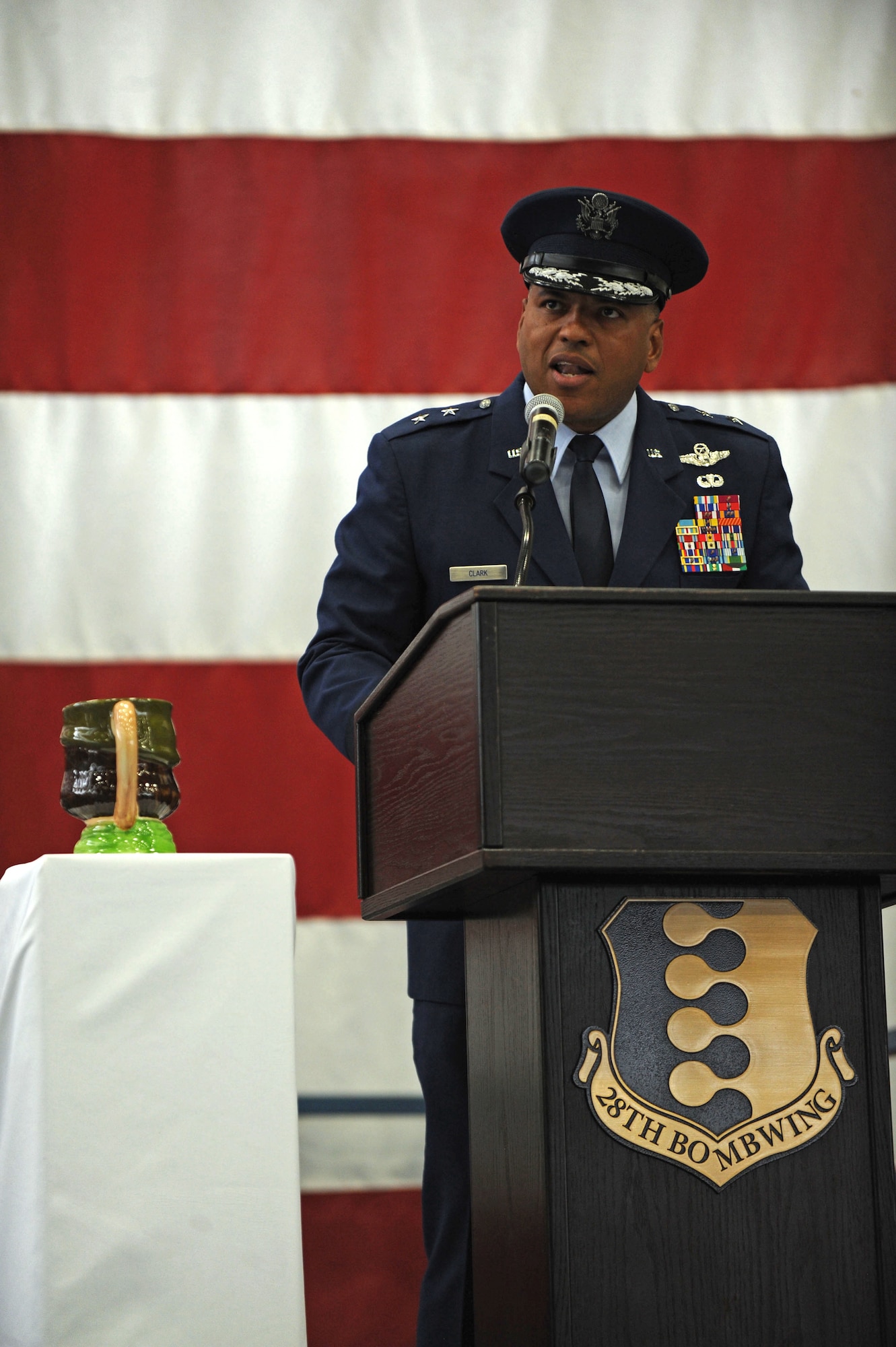 Maj. Gen. Richard Clark, Eighth Air Force commander, stands next to the 28th Bomb Wing Toby jug as he addresses Ellsworth Airmen during the B-1 realignment ceremony at Ellsworth Air Force Base, S.D., Sept. 28, 2015. At the conclusion of the event, the jug was turned to face the crowd, symbolizing Ellsworth’s acceptance of the mission to be ready to deliver combat airpower anywhere in the world, any time. (U.S. Air Force photo by Airman Sadie Colbert/Released)