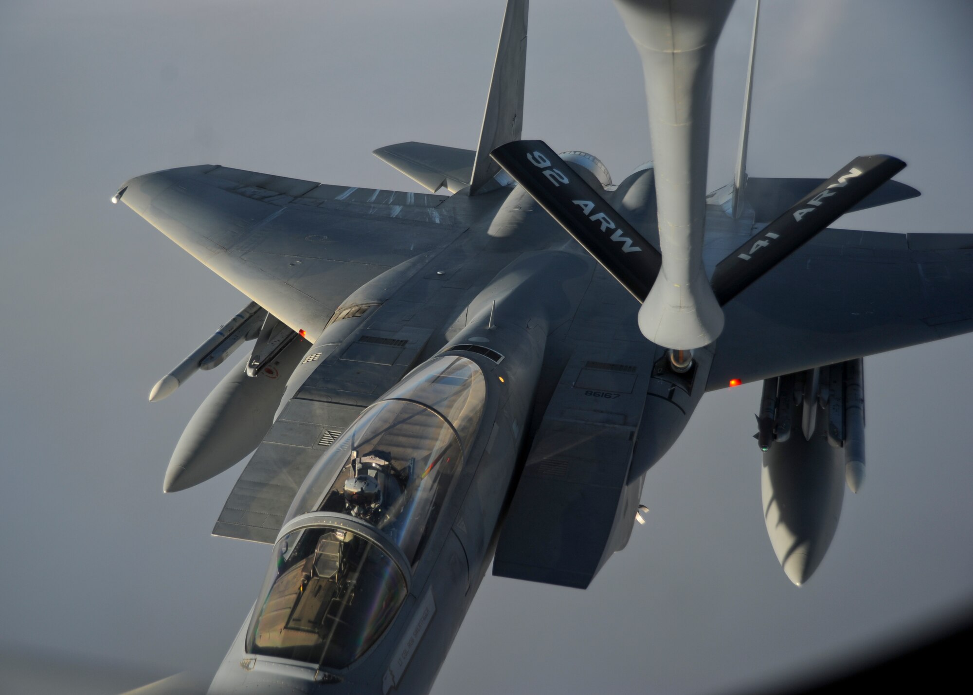 First Lt. Johnathan Pavan, 194th Fighter Squadron pilot, flies an F-15C Eagle assigned to the 144th Fighter Wing, Fresno Air National Guard Base, California, as he receives fuel from a KC-135 Stratotanker assigned to Fairchild Air Force Base, California, Oct. 20, 2015, over northern Canada. From Oct. 15 - 26, 2015, approximately 700 members from the Canadian Armed Forces, United States Air Force, United States Navy, and United States Air National Guard are deploying to Iqaluit, Nunavut, and 5 Wing Goose Bay, Newfoundland and Labrador for Exercise Vigilant Shield 16 (U.S. Air Force photo by Senior Airman Victor J. Caputo)