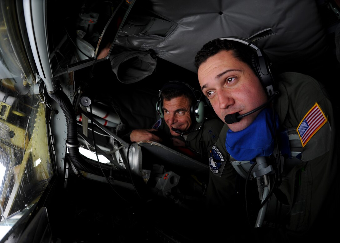 Maj. Gen. Michael Loh, center, mobilization assistant to the commander of North American Aerospace Defense Command and U.S. Northern Command, observes Airman 1st Class Andrew Mays, 344th Air Refueling Squadron boom operater, refuels an aircraft with the boom on a KC-135 Stratotanker, Oct. 24, 2015. Loh was part of a crew transiting to McConnell Air Force, Kan., after the conclusion of Exercise Vigilant Shield 16 at 5 Wing Goose Bay, Canada. (U.S. Air Force photo/Senior Airman Victor J. Caputo)