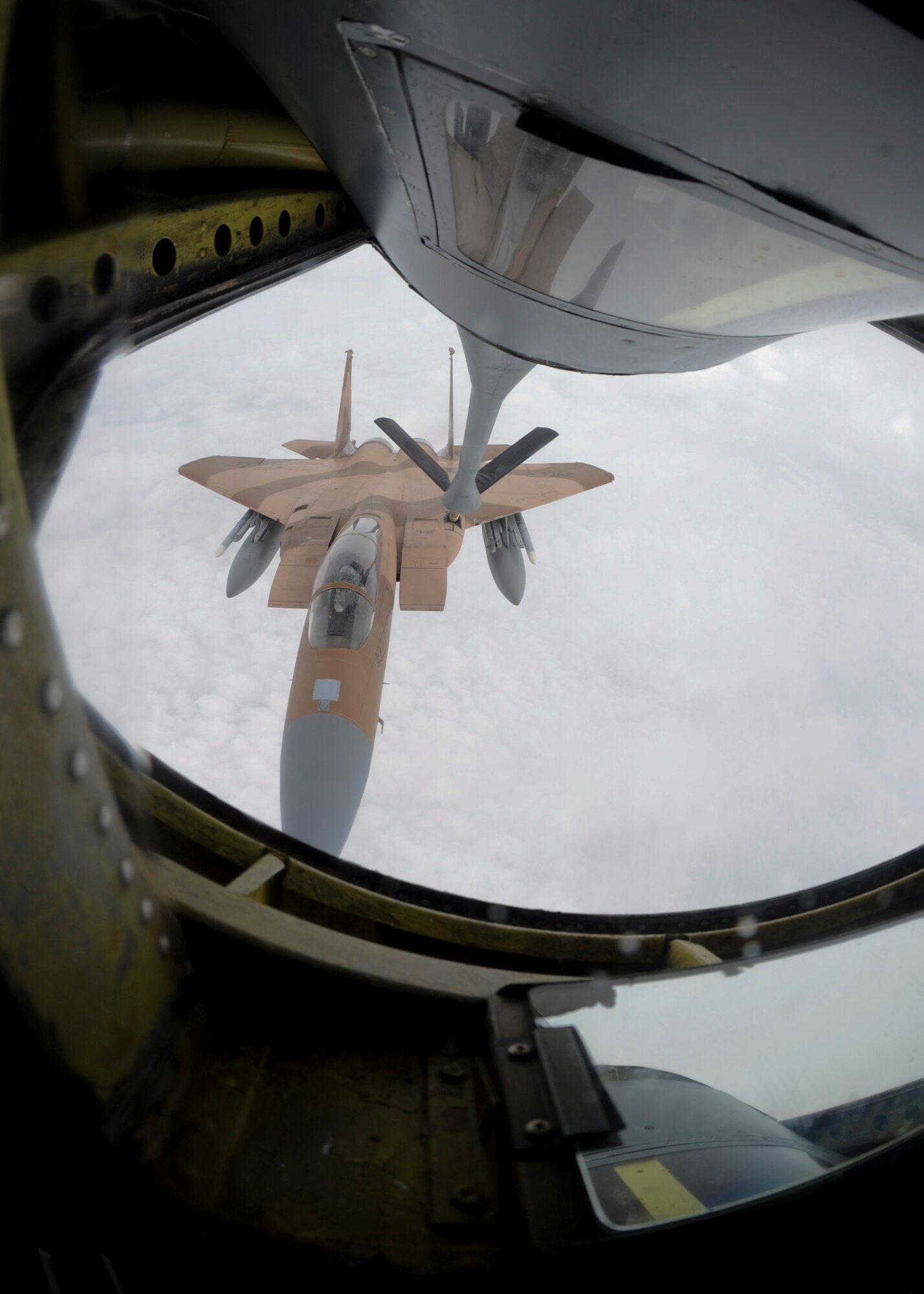 An F-15C Eagle assigned to the 144th Fighter Wing, Fresno Air National Guard Base, Calif., receives fuel from a KC-135 Stratotanker assigned to McConnell Air Force Base, Kan., Oct. 24, 2015. The KC-135 crew escorted several fighters on a flight returning from Exercise Vigilant Shield 16 at 5 Wing Goose Bay, Canada. (U.S. Air Force photo/Senior Airman Victor J. Caputo)