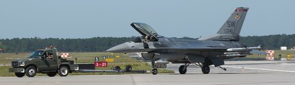 An F-16 Fighting Falcon from Shaw Air Force Base, S.C., flew in to help the 628th Civil Engineering Squadron test the aircraft arresting system on the flight line at Joint Base Charleston – AB, S.C., on Oct. 14, 2015.  The F-16 Fighting Falcon had to travel at least 70 knots to trip the AAS successfully. (U.S. Air Force photo/Airman 1st Class Thomas T. Charlton)