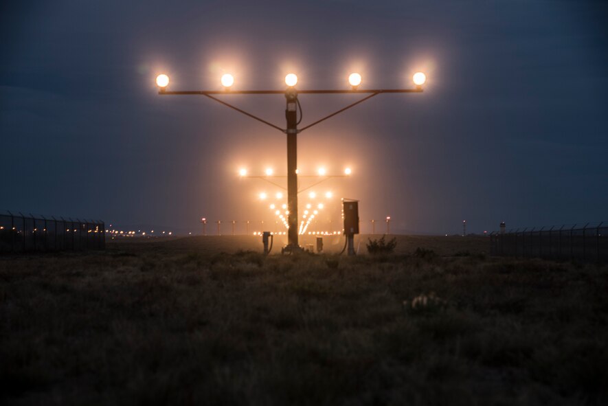 The airfield approach lights guide the path to the runway Oct. 21, 2015, at Fairchild Air Force Base, Wash. The 92nd Operations Support Squadron airfield management team works 24 hours a day to ensure the runway and taxiways are operational. (U.S. Air Force photo/Airman 1st Class Sean Campbell)