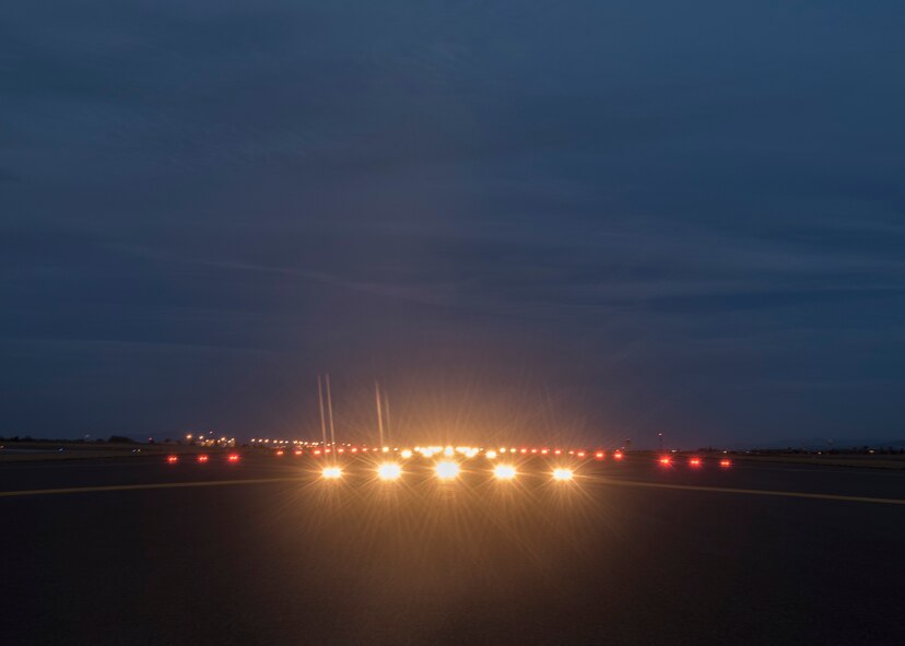 Lights illuminate the runway Oct. 21, 2015, at Fairchild Air Force Base, Wash. The 92nd OSS airfield management night-shift team conducts a check of all the lights on the airfield, to include taxiways, every two hours. (U.S. Air Force photo/Airman 1st Class Sean Campbell)
