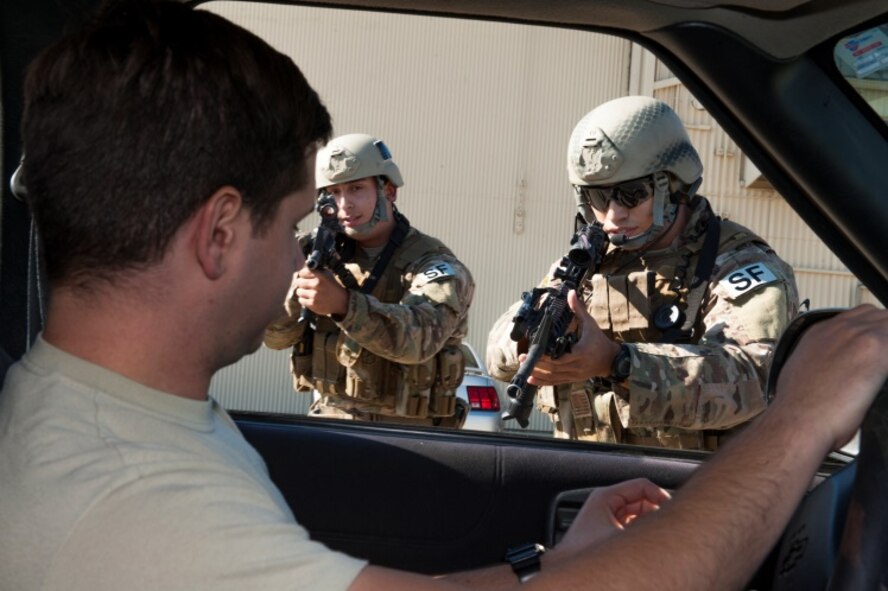 Members of the 791st Missile Security Forces Squadron tactical response force approach a suspect’s vehicle during a training exercise at Minot Air Force Base, N.D., Oct. 8, 2015. TRF perform exercises regularly to help maintain readiness. (U.S. Air Force photo/Airman 1st Class Christian Sullivan)
