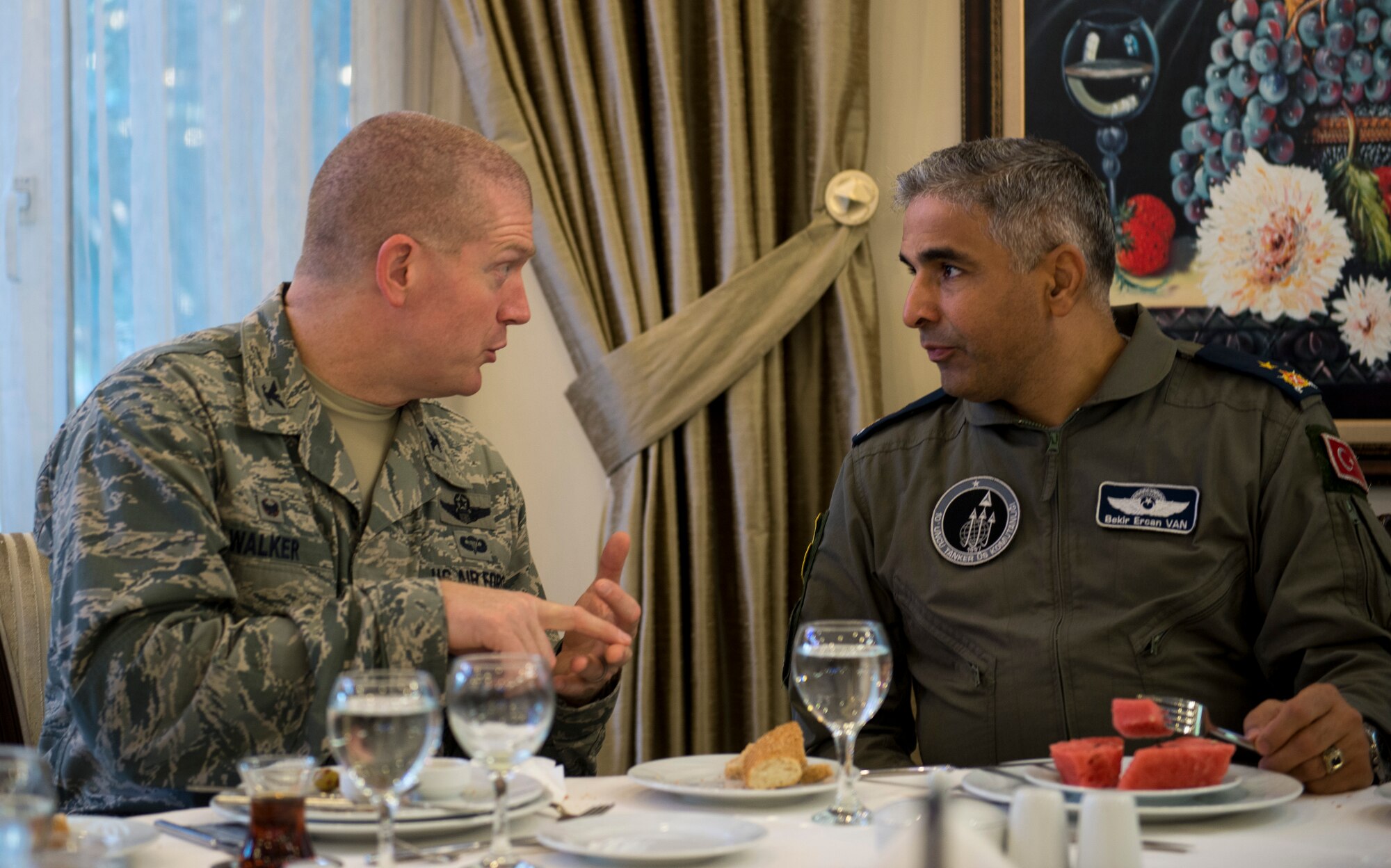 Col. John Walker, 39th Air Base Wing commander, speaks with Brig. Gen. Ercan Van, 10th Tanker Base Command commander, at a Turkish breakfast Oct. 8, 2015. The breakfast was followed by a joint foreign object debris walk where the U. S. and Turkish airmen come together annually to ensure the safety of the flight line and aircraft. (U.S. Air Force photo by Staff Sgt. Eboni Reams/Released)