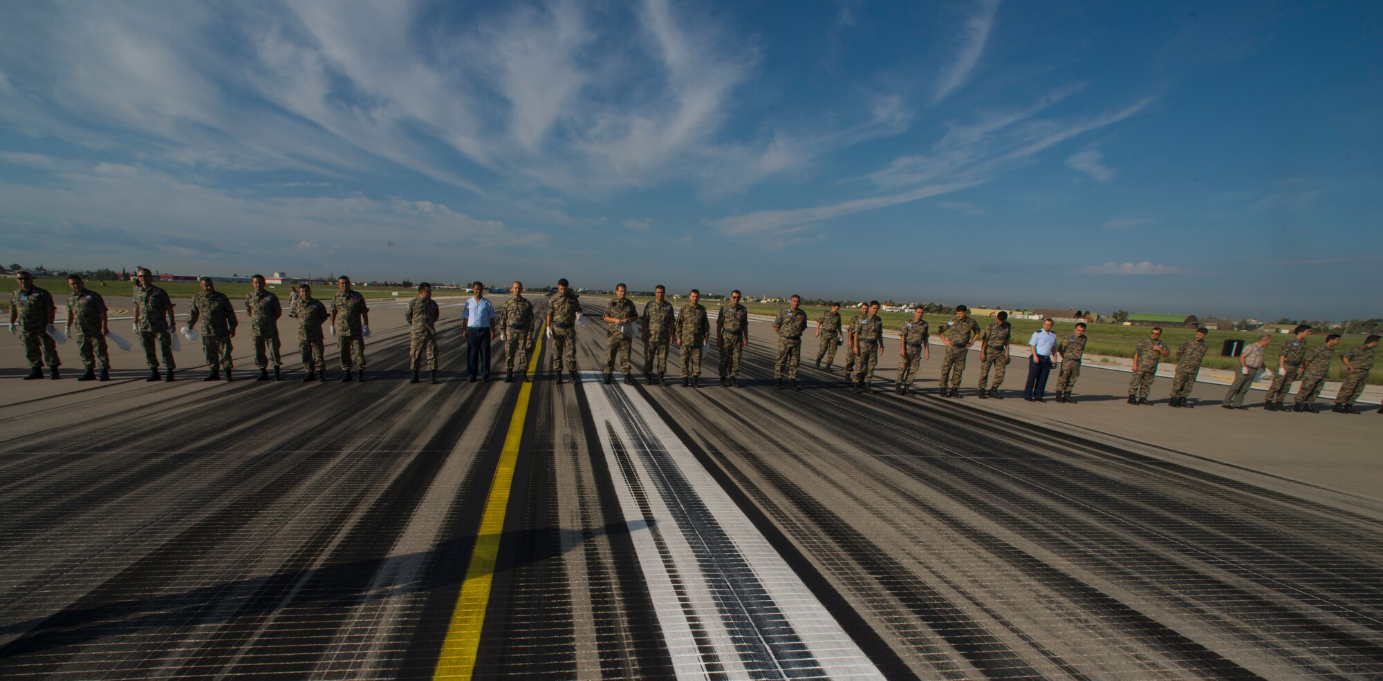 U.S. Airmen from the 39th Air Base Wing worked with Turkish airmen from the 10th Tanker Base Command, to rid the flight line of foreign object debris Oct. 8, 2015, Incirlik Air Base, Turkey. The FOD walk is an annual joint effort to ensure incoming and outgoing aircraft are not damaged by debris. (U.S Air Force photo by Staff Sgt. Eboni Reams/Released)