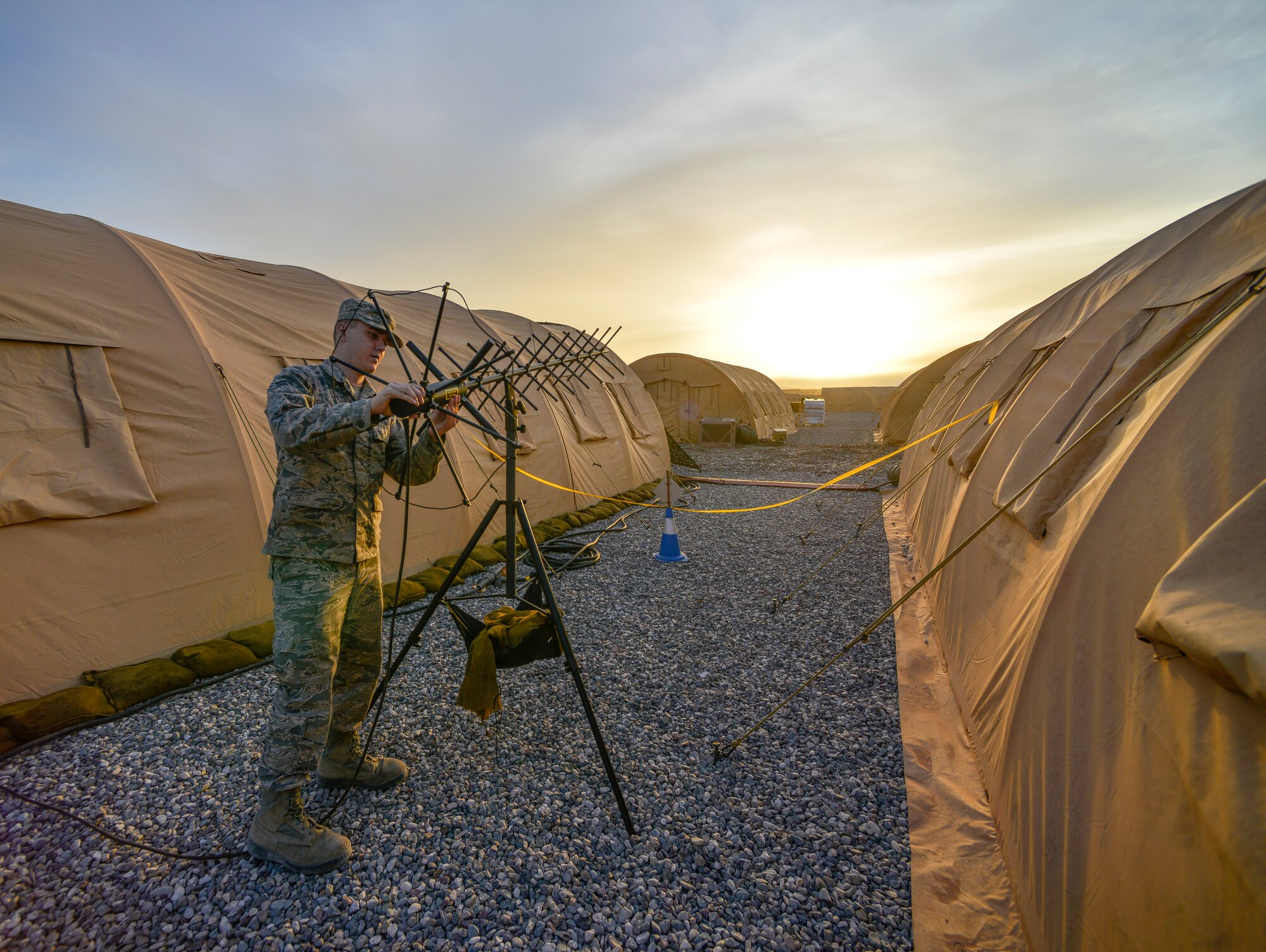 Airman 1st Class Brandon Martin, 1st Combat Communications Squadron tactical network operations technician, adjusts an AV-211 Antenna Oct. 5, 2015, at Diyarbakir Air Base, Turkey. The 1st CBCS stationed at Ramstein, Germany, is a deployment ready force that supplies communications abilities to forces downrange. (U.S. Air Force photo by Airman 1st Class Cory W. Bush/Released)