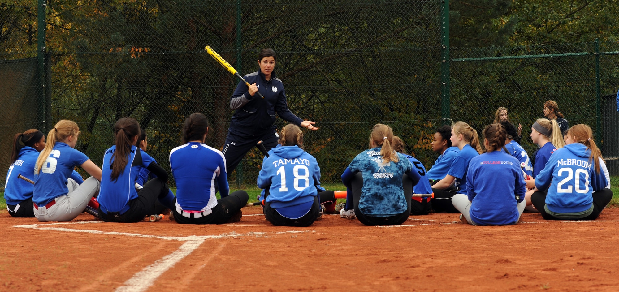 Lizzy Ristano, University of Notre Dame associate softball coach, gives instructions to members of the Ramstein High School Royals varsity softball team Oct. 21, 2015, at Ramstein Air Base, Germany. The Notre Dame coaching staff and players held an instructional softball clinic, a scrimmage and a question and answer session during their visit to the base. (U.S. Air Force photo/Staff Sgt. Sharida Jackson)