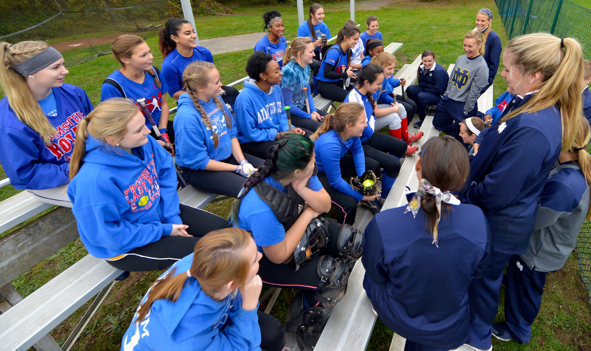 Members of the University of Notre Dame softball team answer questions from the Ramstein High School Royals varsity softball team Oct. 21, 2015, at Ramstein Air Base, Germany. Notre Dame softball team members visited Ramstein Air Base during their 10-day European tour. The tour included softball instructional clinics in which Notre Dame players helped the high school players with offensive and defensive softball skills. (U.S. Air Force photo/Staff Sgt. Sharida Jackson)