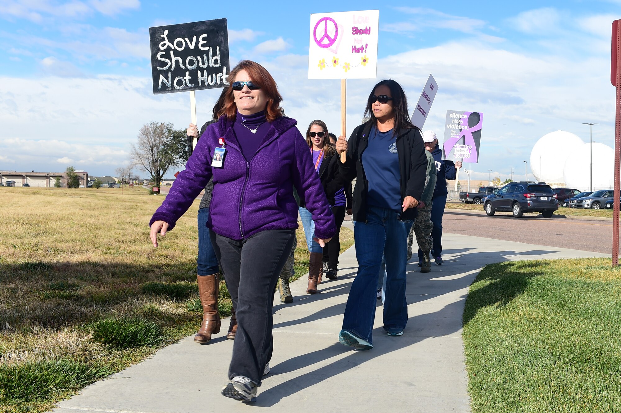 Team Buckley members walk to raise awareness for Domestic Violence Awareness Month Oct. 23, 2015, on Buckley Air Force Base, Colo. According to the National Coalition Against Domestic Violence, there are more than 20,000 phone calls placed to domestic violence hotlines nationwide on a typical day. (U.S. Air Force photo by Airman 1st Class Luke W. Nowakowski/Released) 