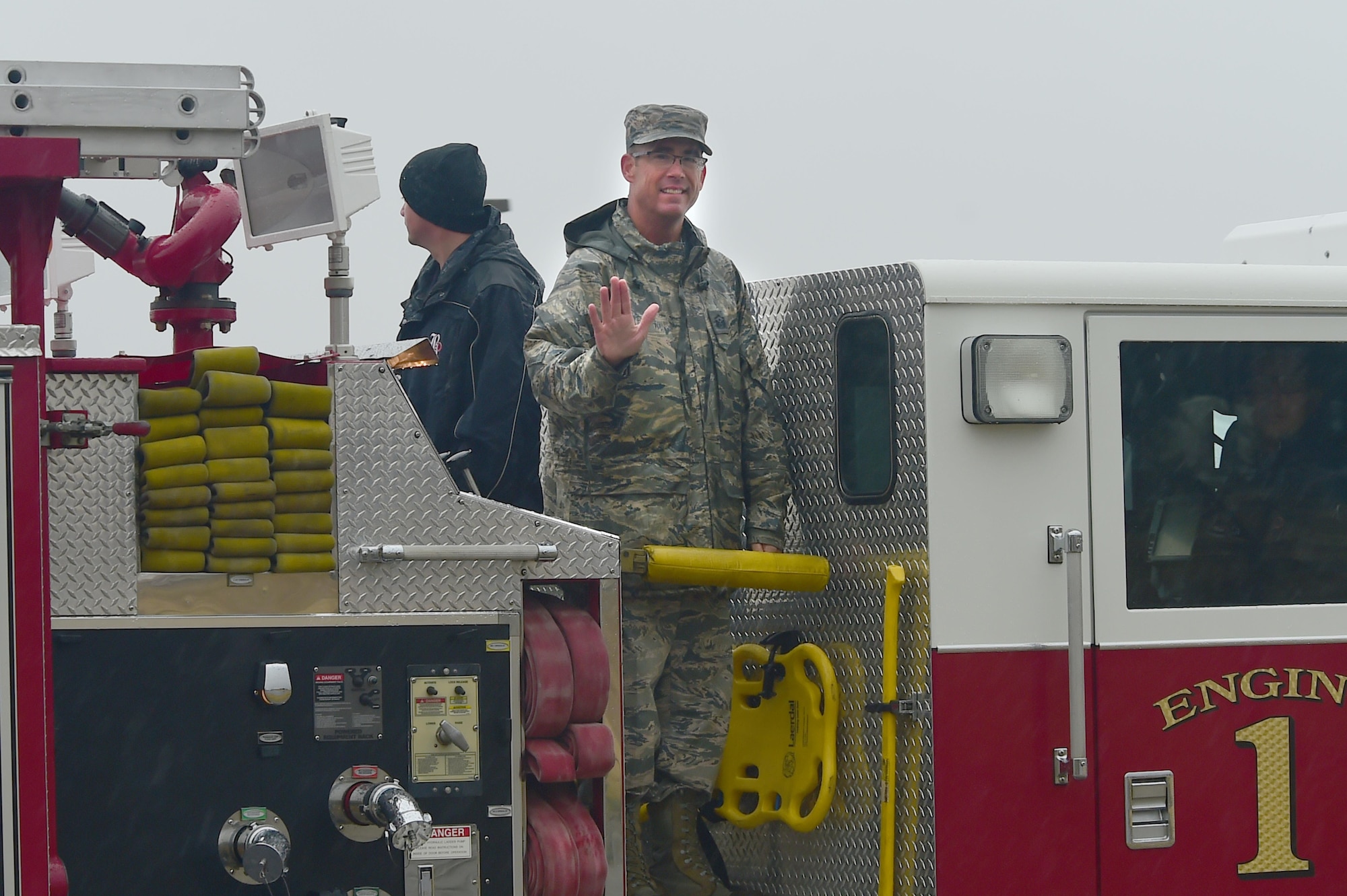 Master Sgt. Troy Drasher, 2nd Space Warning Squadron first sergeant, rides past cheering Team Buckley members Oct. 22, 2015, on Buckley Air Force Base, Colo. Drasher received national attention after completing a 720 mile run from Aurora, Colo. to Abilene, Texas, in order to raise money and awareness for wounded warriors. (U.S. Air Force photo by Airman 1st Class Luke W. Nowakowski/Released) 