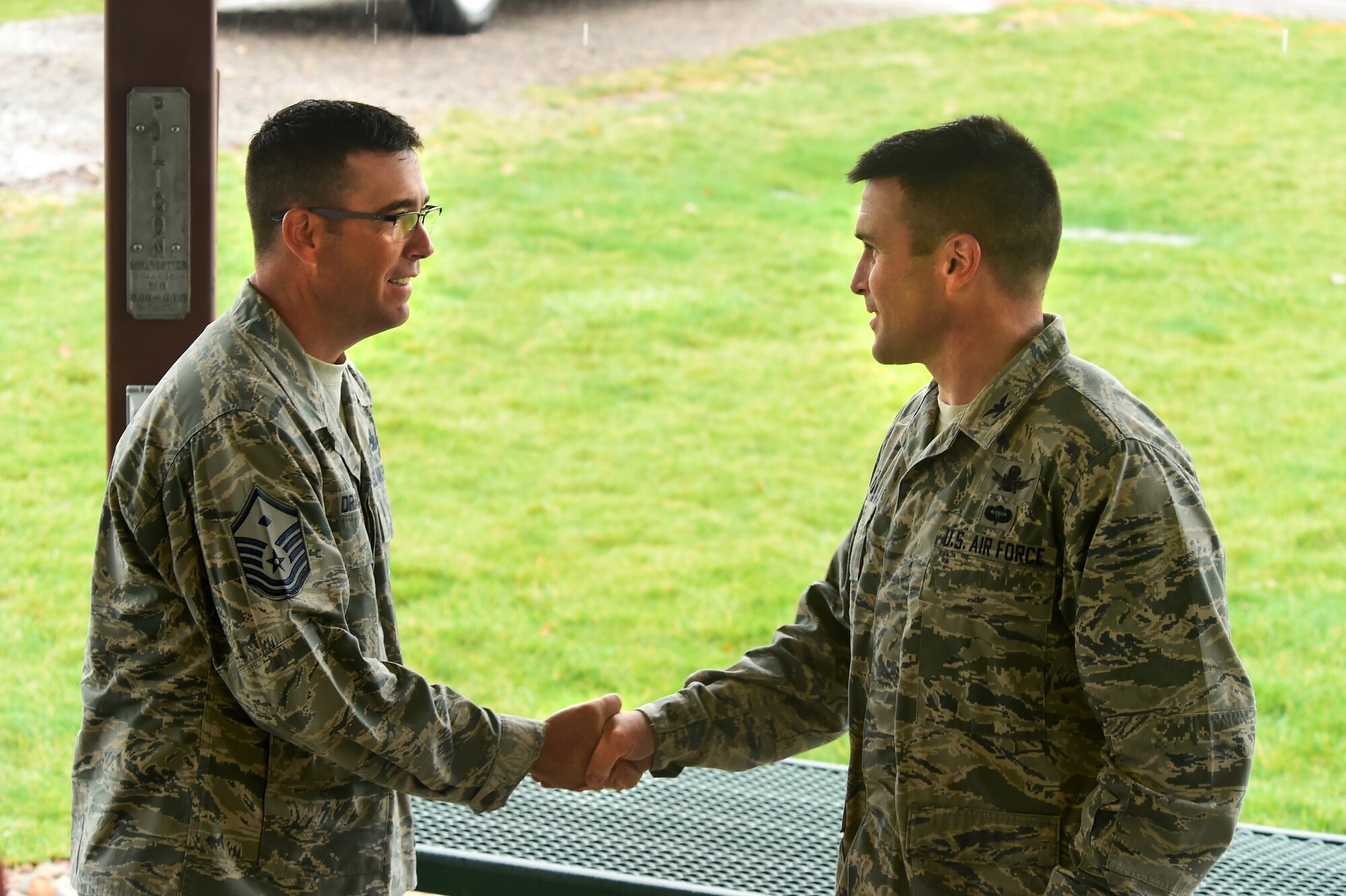 Col. John Wagner, 460th Space Wing commander, awards Master Sgt. Troy Drasher, 2nd Space Warning Squadron first sergeant, a coin Oct. 22, 2015, on Buckley Air Force Base, Colo. Drasher received national attention after completing a 720 mile run from Aurora, Colo. to Abilene, Texas, in order to raise money and awareness for wounded warriors. (U.S. Air Force photo by Airman 1st Class Luke W. Nowakowski/Released)