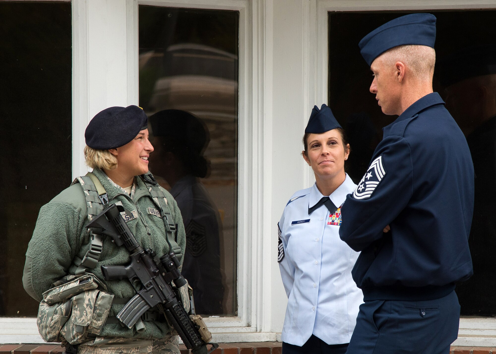 Chief Master Sgt. Michael J. Warner, command chief of Air Force Materiel Command, and Hanscom Command Chief Master Sgt. Patricia Hickey, visit Senior Airman Kaitlyn Laflash, 66th Security Forces Squadron patrolman, at one of the gates on base Oct. 21. In addition to visiting the Airmen at the gates, AFMC's command chief also spent time with at Airmen Leadership Class and 66 SFS. (U.S. Air Force photo by Mark Herlihy)