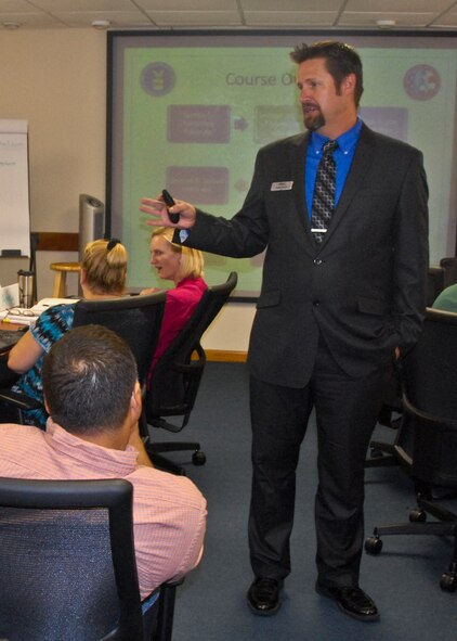 Tim Greene, Department of Labor workshop facilitator, briefs Transition GPS Workshop participants on various aspects of the civilian job search process.  (U.S. Air Force photo/Kevin Gaddie)