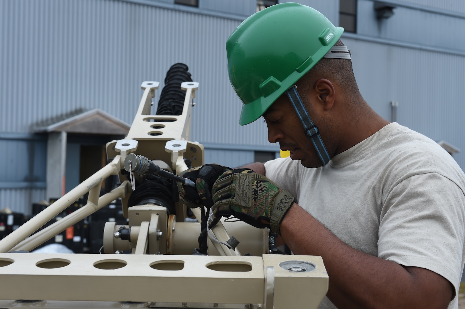 U.S. Air Force Staff Sgt. Joshua Mitchell, radio frequency transmission technician assigned to the 52nd Combat Communications Squadron, works on a ground multi band terminal (GMT) during Vigilant Shield 16 at 5 Wing Goose Bay, Canada, Oct. 10, 2015. From Oct. 15 to 26, 2015, approximately 700 members from the Canadian Armed Forces, the United States Air Force, the United States Navy, and the United States Air National Guard are deploying to Iqualuit, Nunavut, and 5 Wing Goose Bay, Newfoundland and Labrador for Exercise Vigilant Shield 16. (U.S. Air Force photo by Senior Airman Jasmonet Jackson/Released)