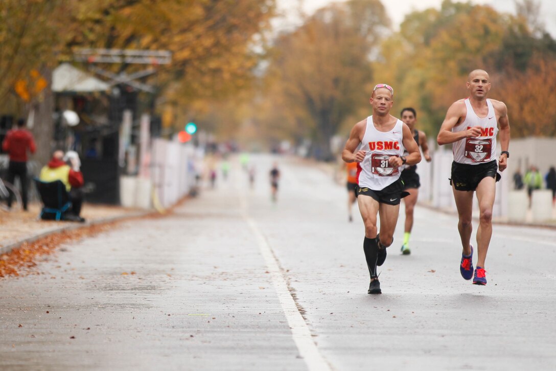 Participants of the 40th Marine Corps Marathon run through the National Mall in Washington, Oct. 25, 2015. More than 30,000 men and women ran in this year’s marathon.