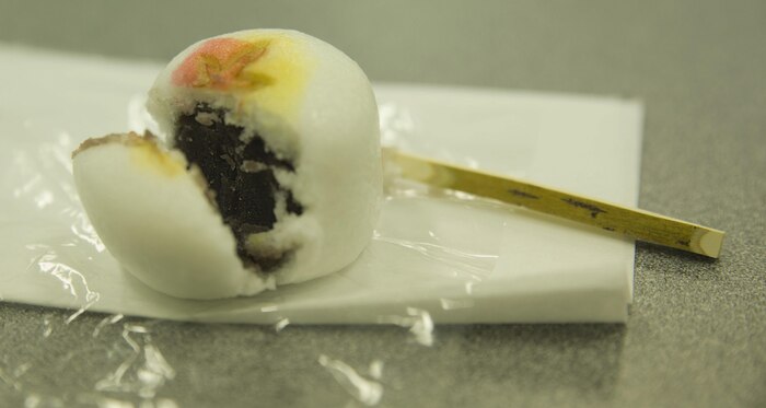 Station residents consumed manjus, a sweet Japanese treat, during a tea ceremony with the Omotesenke Tea Ceremony Club hosted by the Cultural Adaptation Program at Marine Corps Air Station Iwakuni, Japan, Oct. 17, 2015. Manjus are consumed before drinking tea traditionally in Japan. Participants learned this and more during the program increasing their understating of Japanese culture.