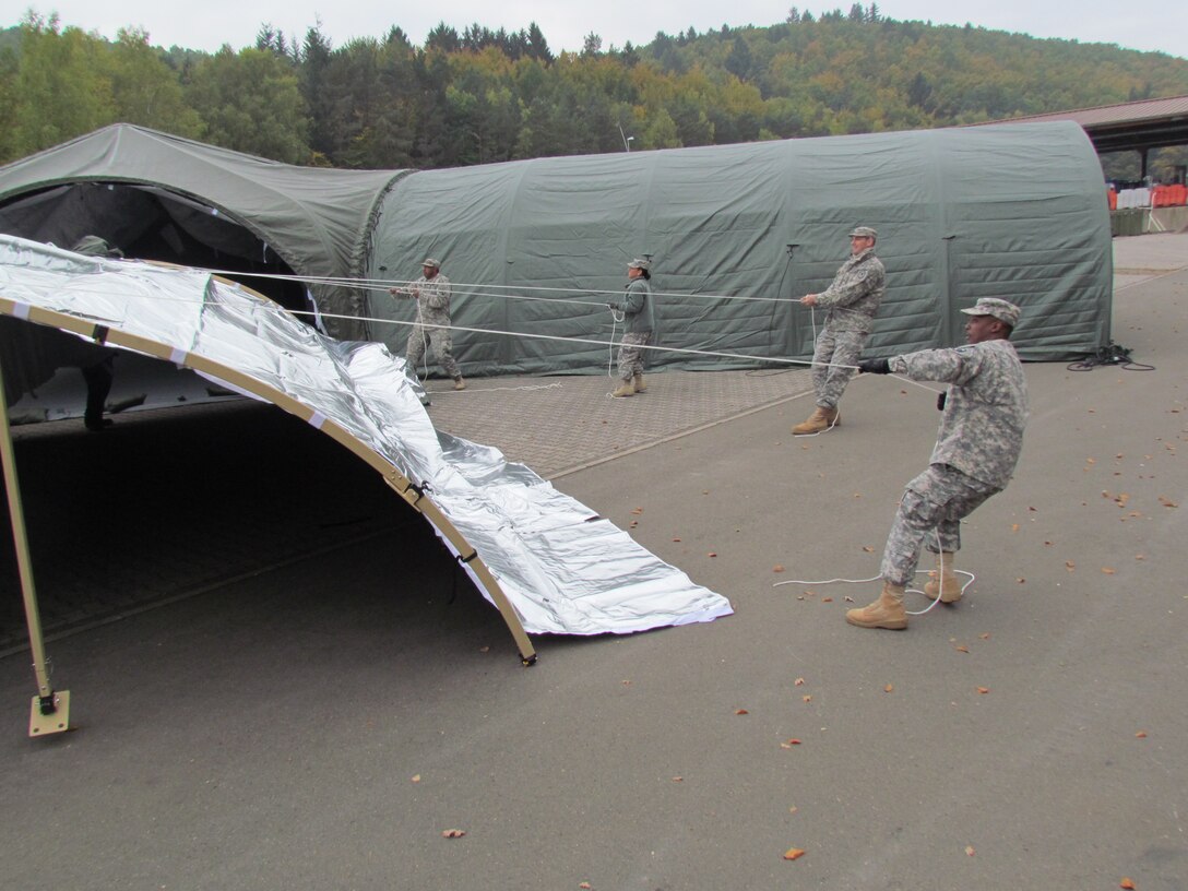 Soldiers of the 7th Mission Support Command train in the deployment of a new modular command tent designed by Soldiers of the 7th MSC Oct. 24 at Panzer Kaserne. The tent is designed to support the mission of the 7th MSC by being rapidly expandable and requiring minimal tools for assembly. (Photo by Lt. Col. Jefferson Wolfe, 7th Mission Support Command Public Affairs Officer)