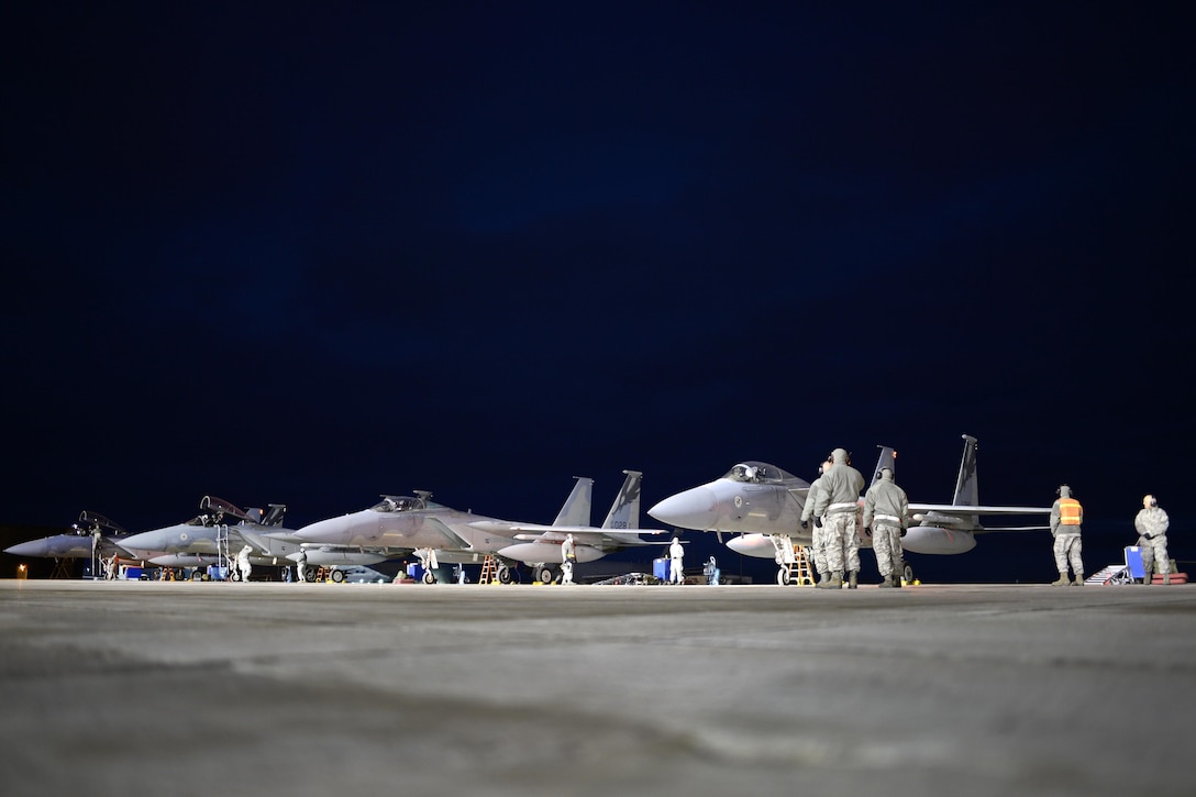 U.S. aircraft crews prepare U.S. Air Force F-15C Eagles for a launch during Exercise Vigilant Shield 16 from 5 Wing Goose Bay, Newfoundland, Oct. 19, 2015. U.S. Air National Guard photo by Staff Sgt. Christian Jadot