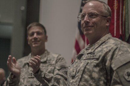 Maj. Gen. Daniel Ammerman, United States Army Civil Affairs and Pychological Operations Command commanding general, leads the applause for Brig. Gen. Richard Sele, 108th Training Command (IET) deputy commanding general, after  promoting him to general officer. Ammerman hosted the ceremony at the Airborne and Special Operations Museum in Fayetteville, N.C., Oct. 25, 2015. Sele, a longtime civil affairs Soldier, takes over for Brig. Gen. A. Ray Royalty as the deputy commanding general of the 108th, headquartered in Charlotte, N.C. (U.S. Army photo by Sgt. 1st Class Brian Hamilton)