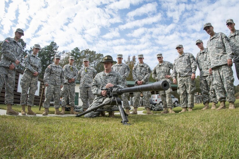 Army Reserve drill sergeant, Sgt. Larry Davis, of Greer, S.C., who is in 1st Bn., 518th Inf. Reg., 2nd Bde., 98th Training Div. (IET), teaches a group of Clemson University Reserve Officer Training Corps cadets how to pull apart a Browning M2 .50-caliber machine gun as part of a leadership training exercise, Oct. 24, 2015. (U.S. Army photo by Sgt. Ken Scar)