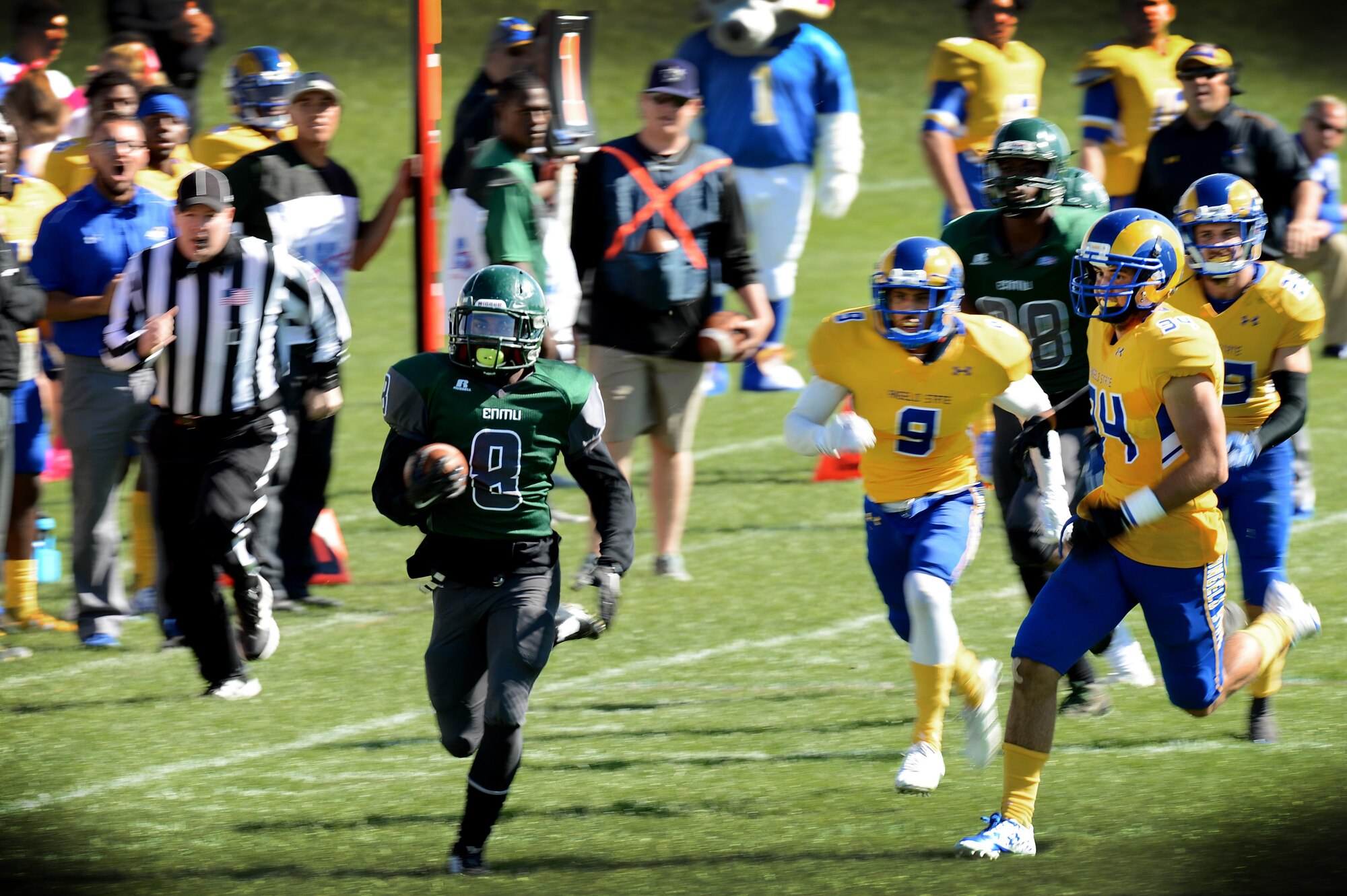 Greyhound running-back Tayshaun Gary breaks away from defenders during a military appreciation game at Blackwater Draw Stadium Oct. 24, 2015, in Clovis, N.M.  Gary rushed for 139 yards and three touchdowns during the Eastern New Mexico University versus Angelo State University game. (U.S. Air Force photo/Staff Sgt. Matthew Plew)