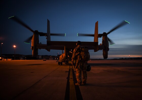 Staff Sgt. Christopher Reedy, 8th Special Operations Squadron flight engineer, steps to a CV-22B Osprey for a night-flying training mission, at Hurlburt Field, Fla., Oct. 22, 2015. The primary mission of the Osprey is to supply special operations forces with long-range infiltration, exfiltration and resupply. (U.S. Air Force photo by Senior Airman Ryan Conroy/Released) 