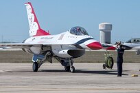 Tech. Sgt. Christopher Audet, U.S. Air Force Air Demonstration Squadron "Thunderbirds" tactical aircraft maintainer, guides a Thunderbird Oct. 26, 2015 at Joint Base San Antonio-Randolph, Texas. The Thunderbirds team members arrived in preparation for the 2015 JBSA-Randolph Air Show and Open House to be held Oct. 31 and Nov. 1.  Air shows allow the Air Force to display the capabilities of our aircraft to the American taxpayer through aerial demonstrations and static displays and allowing attendees to get up close and personal to see some of the equipment and aircraft used by the U.S. military today.  (U.S. Air Force photo by Johnny Saldivar/Released)