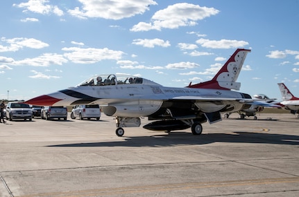 Maj. Tyler Ellison, U.S. Air Force Air Demonstration Squadron "Thunderbirds" operations officer, prepares to depart with passenger Delaine Mathieu, News 4 San Antonio co-anchor, for a media flight Oct. 26, 2015 at Joint Base San Antonio-Randolph, Texas. The Thunderbirds are performing in the 2015 Air Show and Open House at JBSA- Randolph to be held Oct. 31 and Nov. 1. (U.S. Air Force photo by Johnny Saldivar/Released)