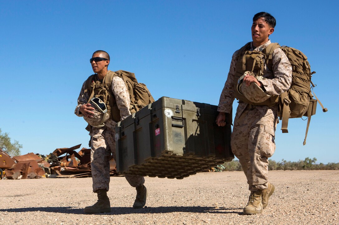 Sailors carry cargo during a casualty evacuation exercise at Fire Base Burt, Chocolate Mountain Aerial Gunnery Range, Calif., Oct. 22, 2015. The sailors are corpsmen assigned to 1st Medical Battalion, 1st Marine Logistics Group. The Marine Aviation Weapons and Tactics Squadron One cadre hosted the seven-week training event. U.S. Marine Corps photo by Lance Cpl. Roderick L. Jacquote