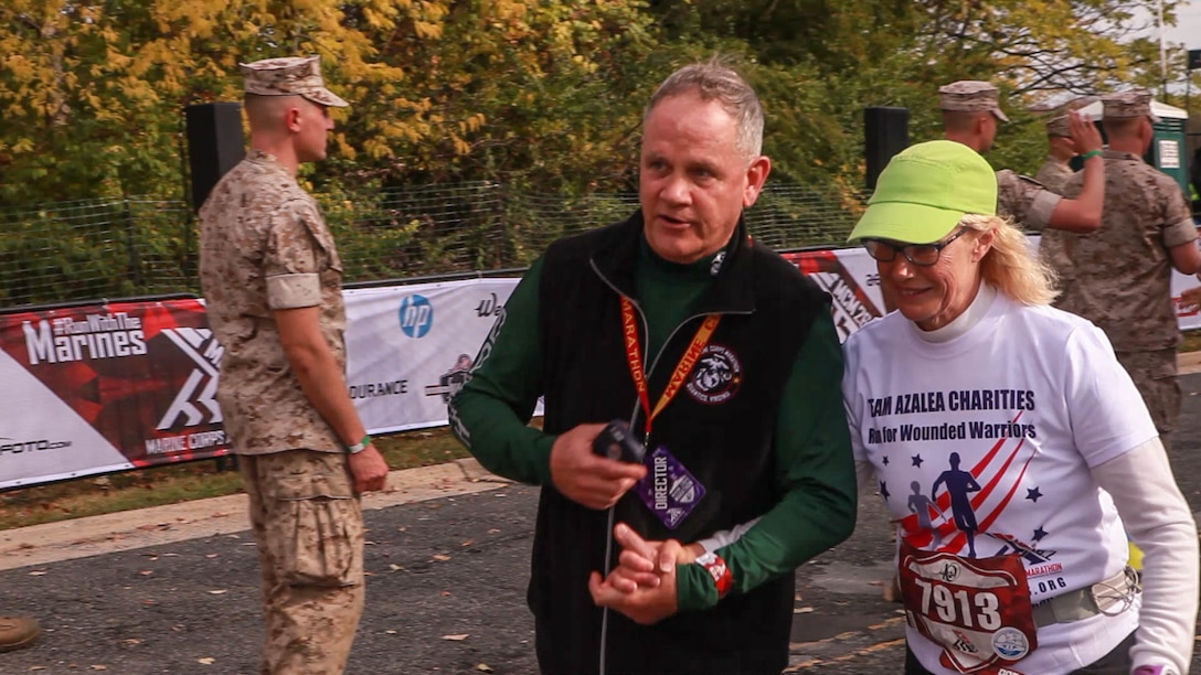 Cynthia Gregory, a runner in the marathon, finishes the 40th Marine Corps Marathon Oct. 25 at the Iwo Jima Memorial in Arlington, Va. Gregory finished the 26.2 miles in seven hours, seven minutes and 21 seconds and ranked 427th in her division.